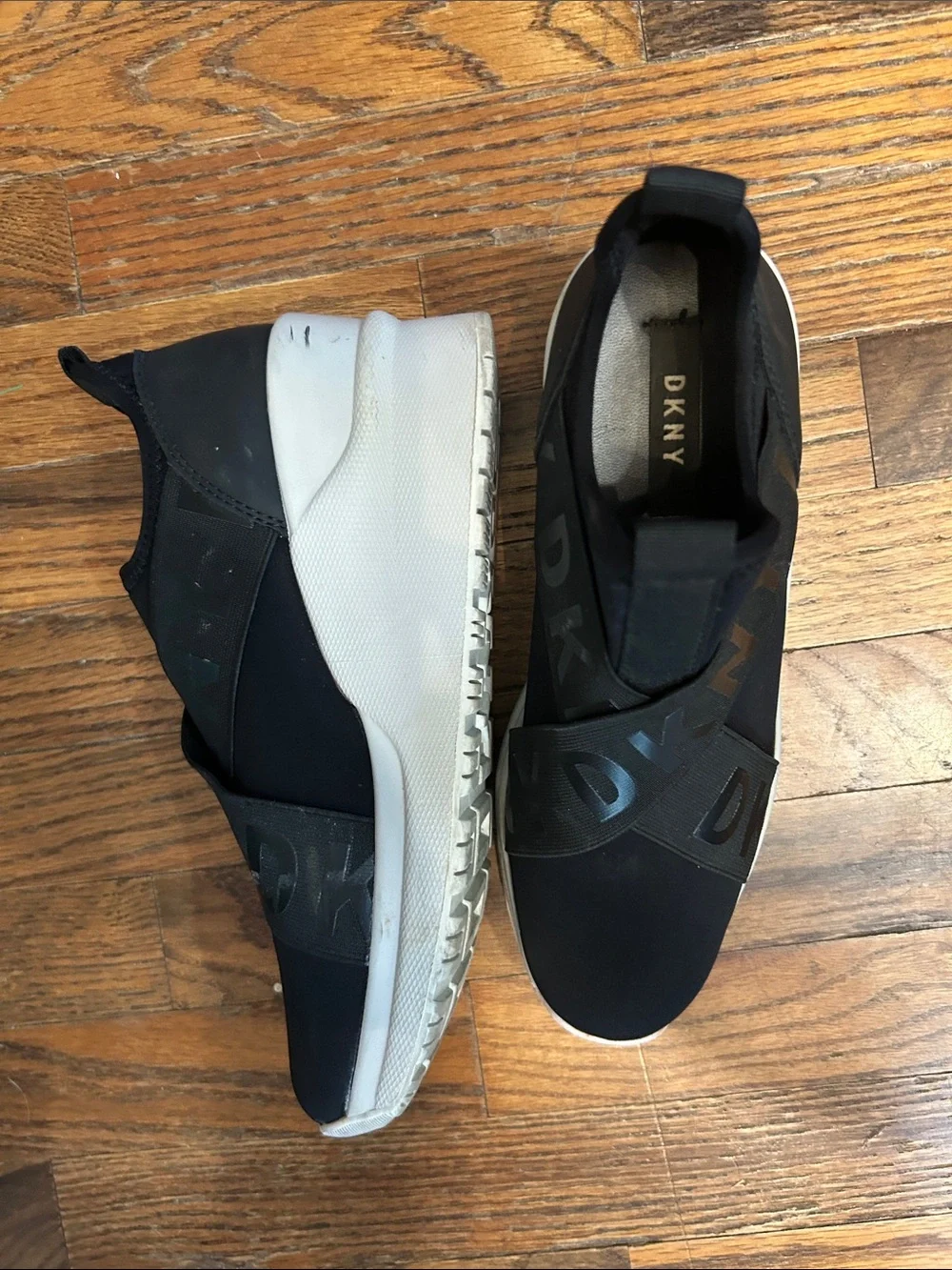 DKNY Black Slip-On Logo-Trim Women’s Sneakers with White Sole